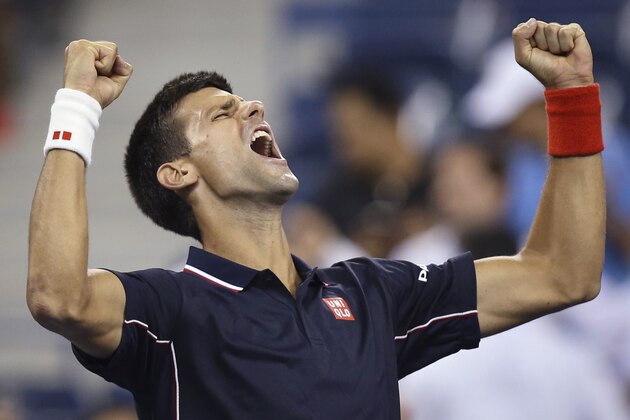 Novak Djokovic, of Serbia, reacts after defeating Andy Murray, of Britain, 7-6 (1), 6-7 (1), 6-2, 6-4 during the quarterfinals of the U.S. Open tennis tournament, early Thursday, Sept. 4, 2014, in New York. (AP Photo/John Minchillo)