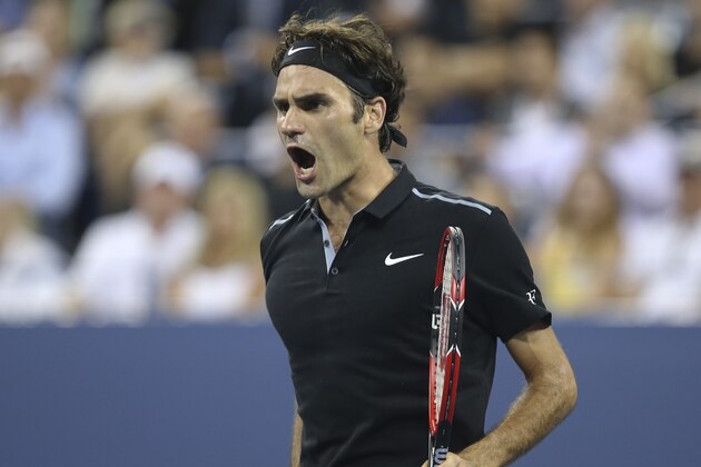 Roger Federer, of Switzerland, reacts after winning the fourth set against Gael Monfils, of France, during the quarterfinals of the U.S. Open tennis tournament, Thursday, Sept. 4, 2014, in New York. Federer won 4-6, 3-6, 6-4, 7-5, 6-2. (AP Photo/John Minchillo)