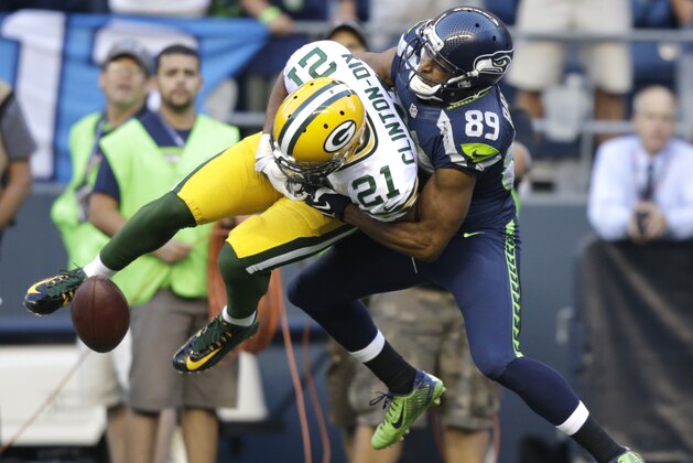 Seattle Seahawks' Doug Baldwin, right, breaks up an interception attempt by Green Bay Packers free safety Ha Ha Clinton-Dix (21) in the first half of an NFL football game, Thursday, Sept. 4, 2014, in Seattle. (AP Photo/Stephen Brashear) Seattle Seahawks' Doug Baldwin, right, breaks up an interception attempt by Green Bay Packers free safety Ha Ha Clinton-Dix (21) in the first half of an NFL football game, Thursday, Sept. 4, 2014, in Seattle. (AP Photo/Stephen Brashear)