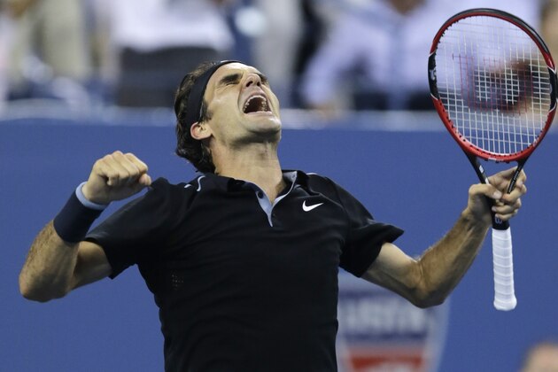 Roger Federer, of Switzerland, celebrates his win over Gael Monfils, of France, during the quarterfinal round of the 2014 U.S. Open tennis tournament, Thursday, Sept. 4, 2014, in New York. Federer defeated Monfils 4-6, 3-6, 6-4, 7-5, 6-2. (AP Photo/Charles Krupa)