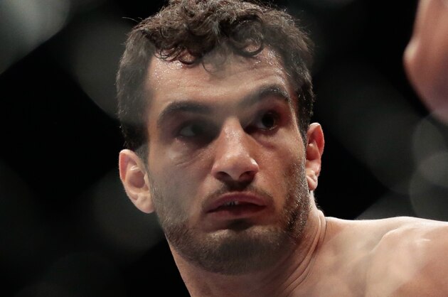 Iranian born Gegard Mousasi, right, fights Mark Munoz from the United States in a middleweight fight during the UFC Fight Night mixed martial arts event in Berlin, Saturday, May 31, 2014.  Gegard Mousasi won the fight. (AP Photo/Markus Schreiber)