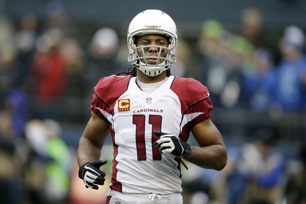 Arizona Cardinals wide receiver Larry Fitzgerald (11) reacts to a play in the first half of an NFL football game against the Seattle Seahawks, Sunday, Dec. 22, 2013, in Seattle. (AP Photo/Stephen Brashear)