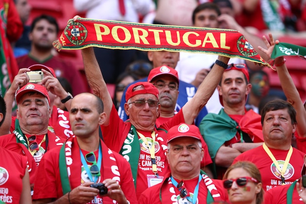 BRASILIA, BRAZIL - JUNE 26:  A Portugal fan holds a scarf during the 2014 FIFA World Cup Brazil Group G match between Portugal and Ghana at Estadio Nacional on June 26, 2014 in Brasilia, Brazil.  (Photo by Adam Pretty/Getty Images)