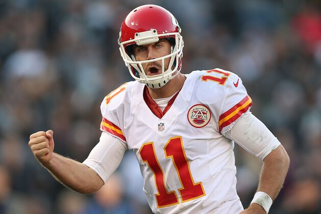 OAKLAND, CA - DECEMBER 15:  Alex Smith #11 of the Kansas City Chiefs celebrates after a touchdown against the Oakland Raiders at O.co Coliseum on December 15, 2013 in Oakland, California.  (Photo by Jed Jacobsohn/Getty Images)