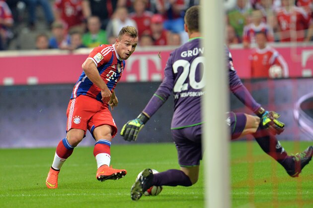 Bayern's Xherdan Shaqiri from Switzerland in action during the  soccer match between FC Bayern Munich and VfL Wolfsburg in the Allianz Arena in Munich, Germany, on Friday, Aug. 22, 2014. (AP Photo/Kerstin Joensson)