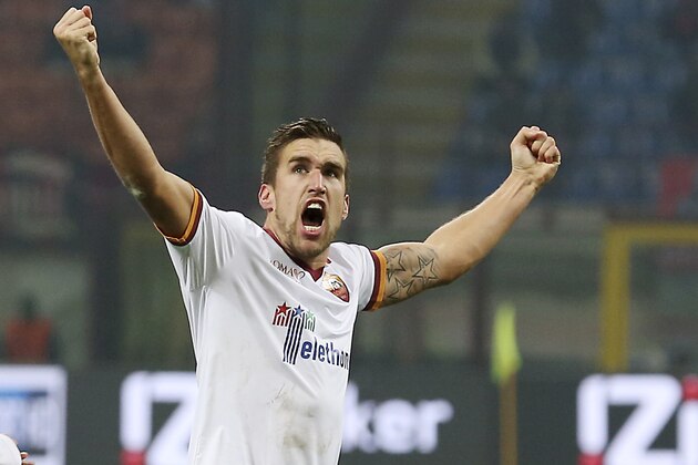 AS Roma midfielder Kevin Strootman, of the Netherlands, celebrates after scoring during the Serie A soccer match between AC Milan and Roma at the San Siro stadium in Milan, Italy, Monday, Dec. 16, 2013. (AP Photo/Antonio Calanni)