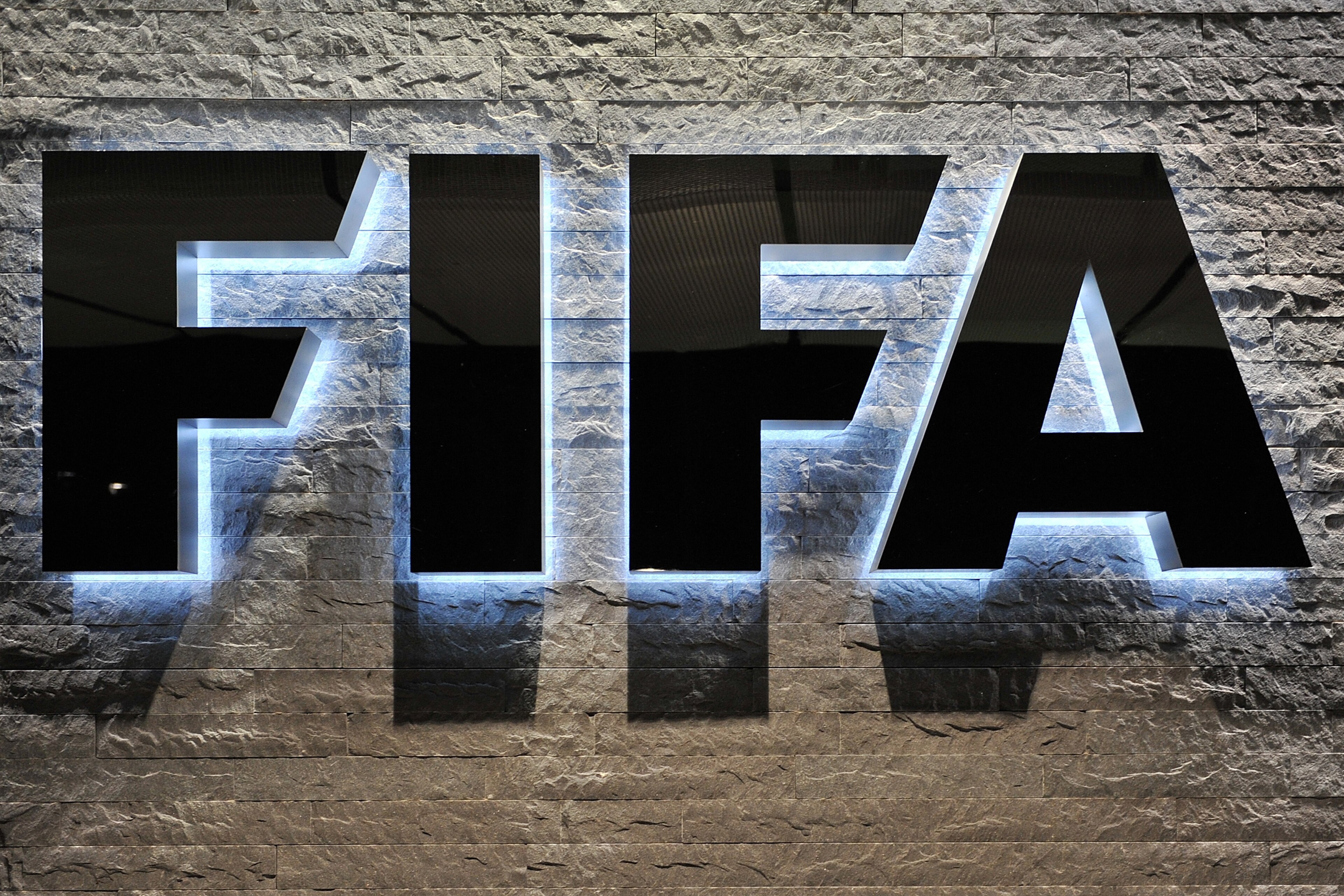 ZURICH, SWITZERLAND - OCTOBER 20: The FIFA logo is seen outside the FIFA headquarters during to the FIFA Executive Committee Meeting on October 20, 2011 in Zurich, Switzerland. During this third meeting of the year, held on two days, the FIFA Executive Committee will approve the match schedules for the FIFA Confederations Cup Brazil 2013 and the 2014 FIFA World Cup Brazil. (Photo by Harold Cunningham/Getty Images) ZURICH, SWITZERLAND - OCTOBER 20: The FIFA logo is seen outside the FIFA headquarters during to the FIFA Executive Committee Meeting on October 20, 2011 in Zurich, Switzerland. During this third meeting of the year, held on two days, the FIFA Executive Committee will approve the match schedules for the FIFA Confederations Cup Brazil 2013 and the 2014 FIFA World Cup Brazil. (Photo by Harold Cunningham/Getty Images)