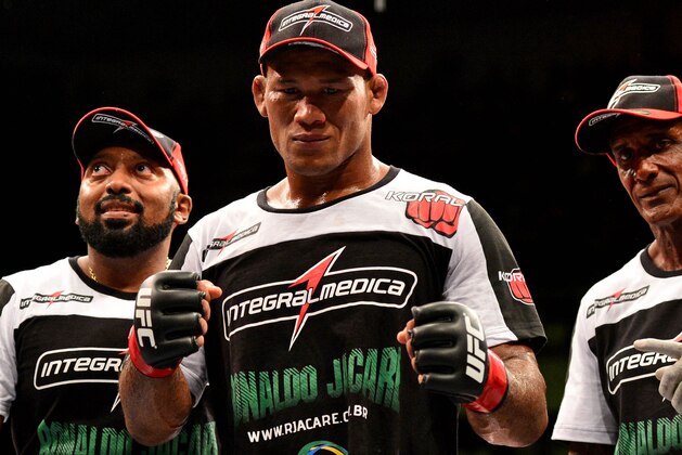Feb 15, 2014; Jaragua do Sul, SC, Brazil; Ronaldo Souza (red gloves) after defeating Francis Carmont (blue gloves) during UFC Fight Night Machida vs Mousasi at Arena Jaragua. Mandatory Credit: Jason Silva-USA TODAY Sports Feb 15, 2014; Jaragua do Sul, SC, Brazil; Ronaldo Souza (red gloves) after defeating Francis Carmont (blue gloves) during UFC Fight Night Machida vs Mousasi at Arena Jaragua. Mandatory Credit: Jason Silva-USA TODAY Sports