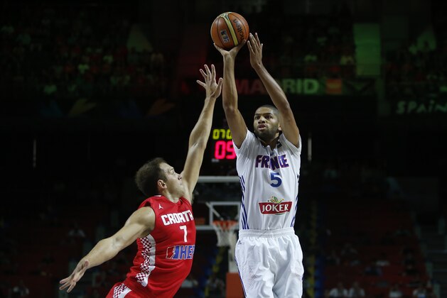 France's Nicolas Batum, right, shoots over Croatia's Bojan Bogdanovic, left, during the  Basketball World Cup  Round of 16 match between Croatia and France in Madrid, Spain, Saturday, Sept. 6, 2014. The 2014 Basketball World Cup competition will take place in various cities in Spain from Aug. 30 through to Sept. 14. (AP Photo/Andres Kudacki)