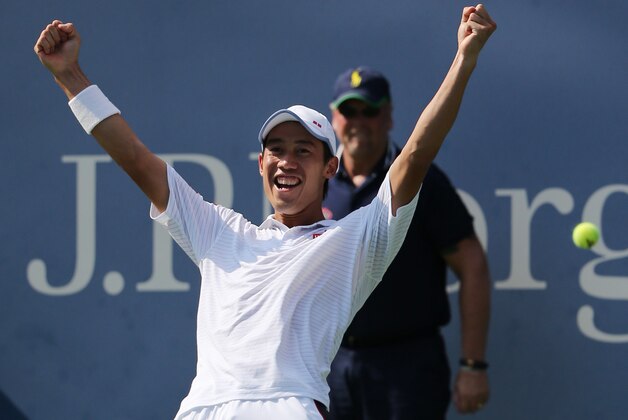 Kei Nishikori, of Japan, reacts after defeating Novak Djokovic, of Serbia, during the semifinals of the 2014 U.S. Open tennis tournament, Saturday, Sept. 6, 2014, in New York. (AP Photo/Mike Groll)