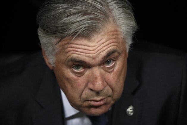 Real Madrid's coach Carlo Ancelotti from Italy, pauses before a Spanish Super Cup soccer match against Atletico Madrid at Santiago Bernabeu stadium in Madrid, Spain, Tuesday, Aug. 19, 2014 . (AP Photo/Daniel Ochoa de Olza)