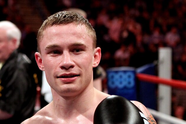 SHEFFIELD, ENGLAND - MARCH 17:  Carl Frampton (R) celebrates his victory over Prosper Ankrah in their Super Bantamweight Championship bout at the Sheffield Motorpoint Arena on March 17, 2012 in Sheffield, England.  (Photo by Scott Heavey/Getty Images)