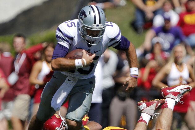 Kansas State quarterback Jake Waters (15) breaks away from the grasp of Iowa State linebacker Jevohn Miller (55) during the second half of an NCAA college football game Saturday, Sept. 6, 2014, in Ames, Iowa. (AP Photo/Justin Hayworth)