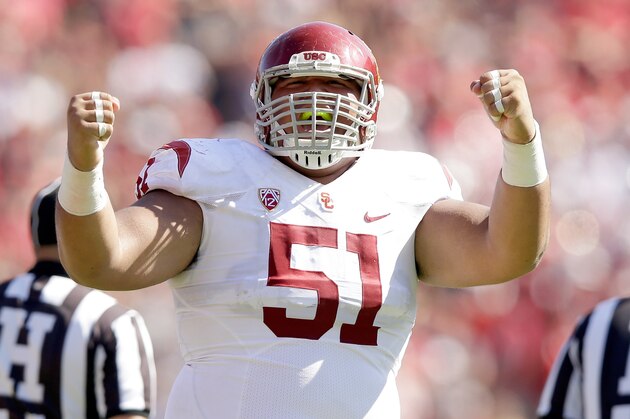 PALO ALTO, CA - SEPTEMBER 06:  Joel Foy #51 of the USC Trojans celebrates after the Trojans recovered a fumble by Kevin Hogan #8 of the Stanford Cardinal in the final minute of their game their clinched their victory at Stanford Stadium on September 6, 2014 in Palo Alto, California.  (Photo by Ezra Shaw/Getty Images)