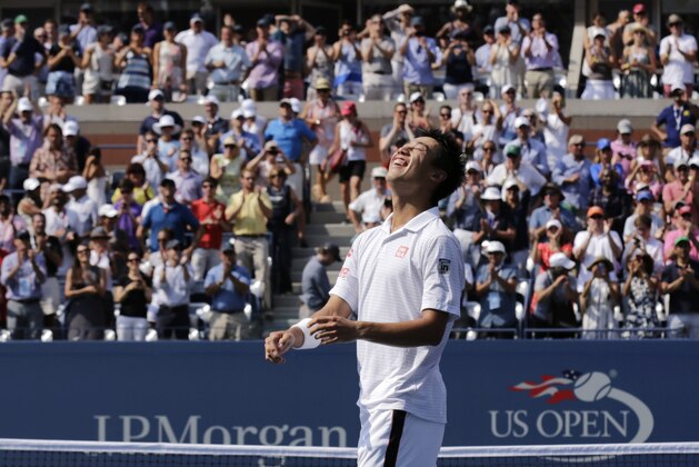 Kei Nishikori, of Japan, reacts after defeating Novak Djokovic, of Serbia, during the semifinals of the 2014 U.S. Open tennis tournament, Saturday, Sept. 6, 2014, in New York. (AP Photo/Charles Krupa)