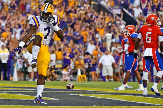 LSU running back Leonard Fournette (7) celebrates after scoring a touchdown on a 4-yard run during the first half of an NCAA college football game against Sam Houston State in Baton Rouge, La., Saturday, September 6, 2014. (AP Photo/Jonathan Bachman)