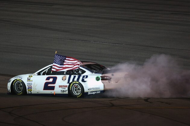 RICHMOND, VA - SEPTEMBER 06:  Brad Keselowski, driver of the #2 Miller Lite Ford, celebrates with a burnout after winning the NASCAR Sprint Cup Series Federated Auto Parts 400 at Richmond International Raceway on September 6, 2014 in Richmond, Virginia.  (Photo by Todd Warshaw/Getty Images)