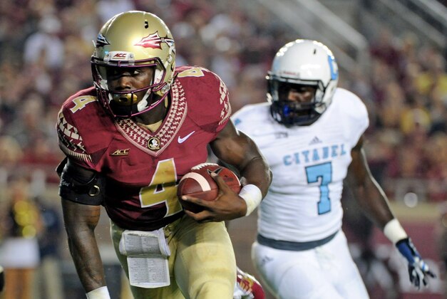 Sep 6, 2014; Tallahassee, FL, USA; Florida State Seminoles running back Dalvin Cook (4) runs the ball for a touchdon as he is pressured by Citadel Bulldogs defensive lineman Mark Thomas (7) during the first half at Doak Campbell Stadium. Mandatory Credit: Melina Vastola-USA TODAY Sports