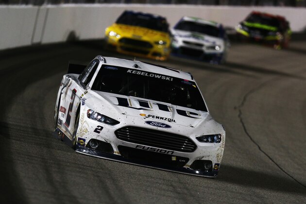 RICHMOND, VA - SEPTEMBER 06:  Brad Keselowski, driver of the #2 Miller Lite Ford, leads a pack of cars during the NASCAR Sprint Cup Series Federated Auto Parts 400 at Richmond International Raceway on September 6, 2014 in Richmond, Virginia.  (Photo by Todd Warshaw/Getty Images)