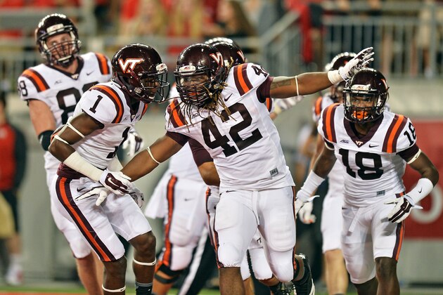 COLUMBUS, OH - SEPTEMBER 6:  Marshawn Williams #42 of the Virginia Tech Hokies celebrates his 15-yard touchdown run in the first quarter against the Ohio State Buckeyes with Isaiah Ford #1 at Ohio Stadium on September 6, 2014 in Columbus, Ohio.  (Photo by Jamie Sabau/Getty Images)