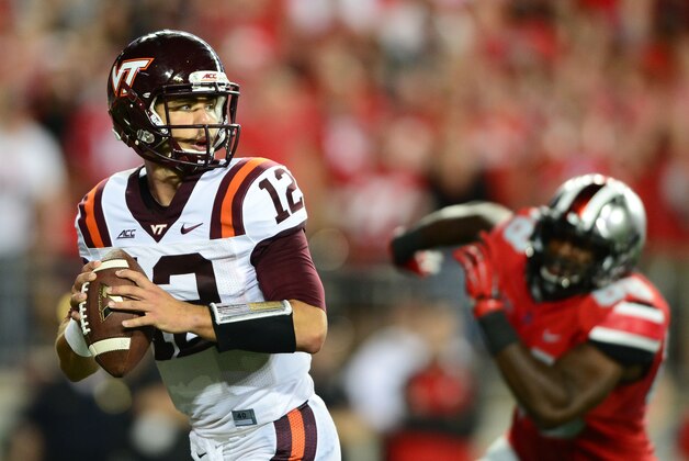 Sep 6, 2014; Columbus, OH, USA; Virginia Tech Hokies quarterback Michael Brewer (12) looks to pass during the third quarter against the Ohio State Buckeyes at Ohio Stadium. Mandatory Credit: Andrew Weber-USA TODAY Sports