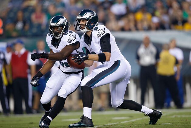Philadelphia Eagles' Nick Foles, right, and LeSean McCoy run a play during the first half of an NFL preseason football game against the Pittsburgh Steelers, Thursday, Aug. 21, 2014, in Philadelphia. (AP Photo/Michael Perez)