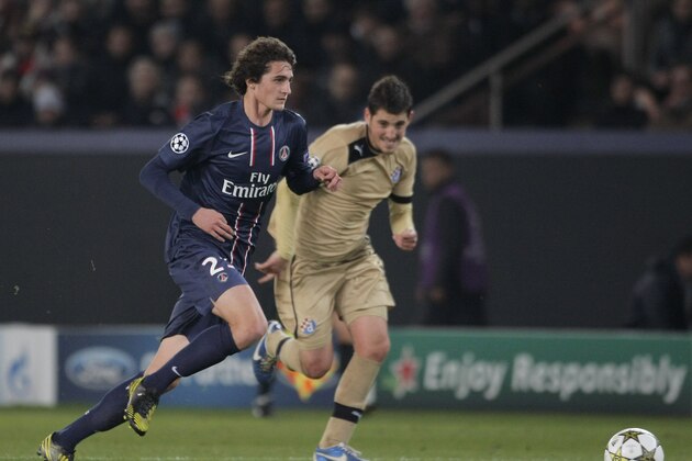 Paris Saint Germain's midfielder Adrien Rabiot, left, challenges for the ball with Dinamo Zagbreb's forward Ante Rukavina, right, during their  Champions League group A soccer match between Dinamo Zagreb and Paris Saint Germain, at the Parc des Princes Stadium, in Paris, Tuesday, Nov. 6, 2012. Paris Saint Germain defeated Dinamo Zagreb 4-0. (AP Photo/Thibault Camus)