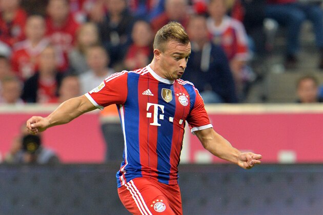 Bayern's Xherdan Shaqiri from Switzerland controls the ball during the  soccer match between FC Bayern Munich and VfL Wolfsburg in the Allianz Arena in Munich, Germany, on Friday, Aug. 22, 2014. (AP Photo/Kerstin Joensson)