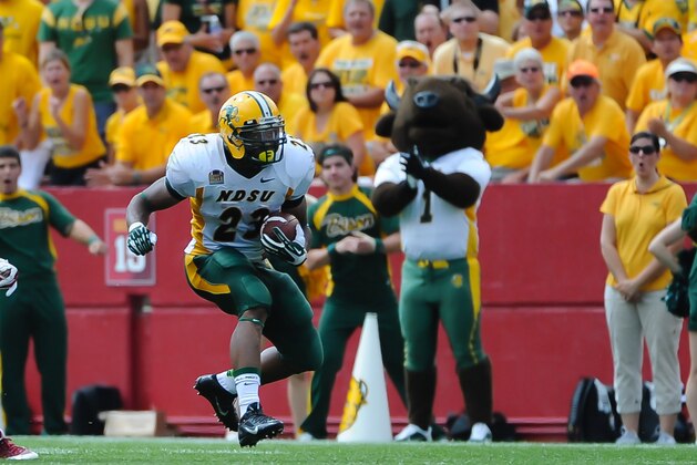 Aug 30, 2014; Ames, IA, USA; North Dakota State Bison running back John Crockett (23) breaks free against the Iowa State Cyclones  at Jack Trice Stadium. Mandatory Credit: Steven Branscombe-USA TODAY Sports