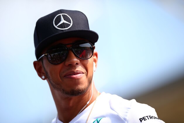 MONZA, ITALY - SEPTEMBER 07:  Lewis Hamilton of Great Britain and Mercedes GP takes part in the Drivers Parade prior to the F1 Grand Prix of Italy at Autodromo di Monza on September 7, 2014 in Monza, Italy.  (Photo by Mark Thompson/Getty Images)