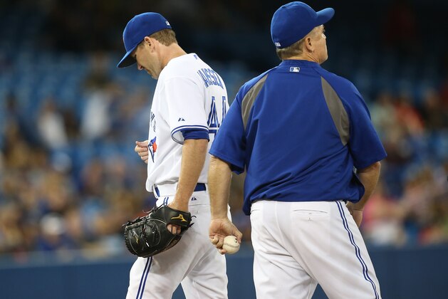 TORONTO, CANADA - AUGUST 8: Casey Janssen #44 of the Toronto Blue Jays exits the game as he is relieved by manager John Gibbons #5 in the ninth inning during MLB game action against the Detroit Tigers on August 8, 2014 at Rogers Centre in Toronto, Ontario, Canada. (Photo by Tom Szczerbowski/Getty Images)