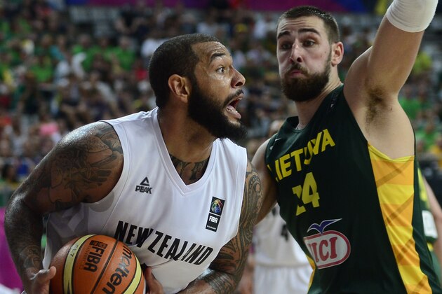 New Zealand's Bj Anthony, left, vies for the ball over Lithuania's Jonas Valanciunas during Basketball World Cup Round of 16 match between New Zealand and Lithuania at the Palau Sant Jordi in Barcelona, Spain, Sunday, Sept. 7, 2014. The 2014 Basketball World Cup competition will take place in various cities in Spain from Aug. 30 through to Sept. 14. (AP Photo/Manu Fernandez)