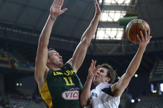 New Zealand's Thomas Abercrombie, right, is challenged by Lithuania's Donatas Motiejunas during their Basketball World Cup Round of 16 match at the Palau Sant Jordi in Barcelona, Spain, Sunday Sept. 7, 2014. The 2014 Basketball World Cup competition will take place in various cities in Spain from Aug. 30 through to Sept. 14. (AP Photo/Manu Fernandez)