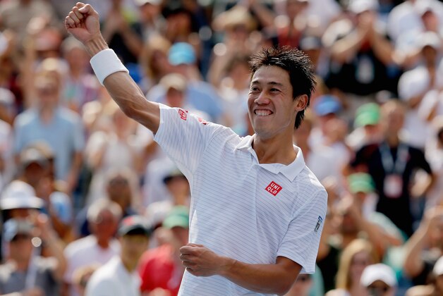 NEW YORK, NY - SEPTEMBER 06:  Kei Nishikori of Japan celebrates after defeating Novak Djokovic of Serbia in their men's singles semifinal match on Day Thirteen of the 2014 US Open at the USTA Billie Jean King National Tennis Center on September 6, 2014 in the Flushing neighborhood of the Queens borough of New York City.  (Photo by Mike Stobe/Getty Images for USTA)