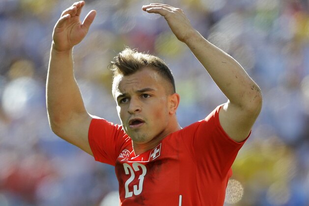 Switzerland's Xherdan Shaqiri urges support from the Swiss fans during the World Cup round of 16 soccer match between Argentina and Switzerland at the Itaquerao Stadium in Sao Paulo, Brazil, Tuesday, July 1, 2014. (AP Photo/Sergei Grits) Switzerland's Xherdan Shaqiri urges support from the Swiss fans during the World Cup round of 16 soccer match between Argentina and Switzerland at the Itaquerao Stadium in Sao Paulo, Brazil, Tuesday, July 1, 2014. (AP Photo/Sergei Grits)