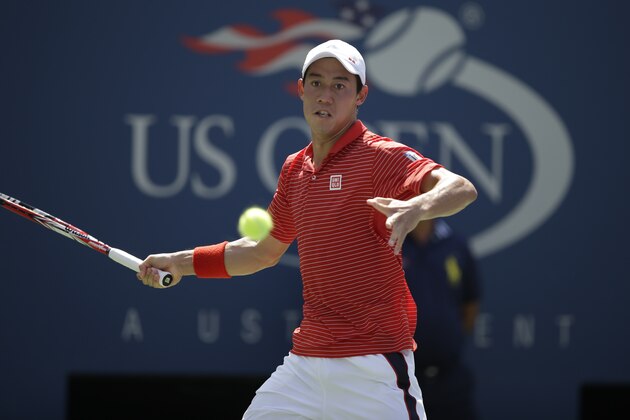 Kei Nishikori, of Japan, returns a shot to Novak Djokovic, of Serbia, in the semifinals of the 2014 U.S. Open tennis tournament, Saturday, Sept. 6, 2014, in New York. (AP Photo/Darron Cummings)
