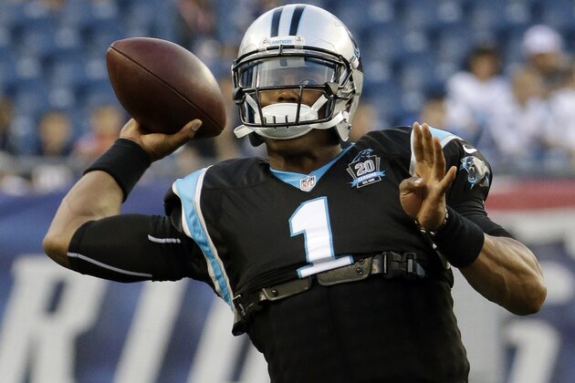 Carolina Panthers quarterback Cam Newton warms up before an NFL preseason football game against the New England Patriots, Friday, Aug. 22, 2014, in Foxborough, Mass. (AP Photo/Stephan Savoia)