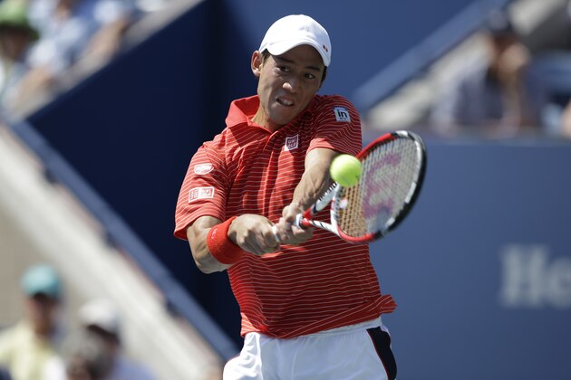 Kei Nishikori, of Japan, returns a shot to Novak Djokovic, of Serbia, in the semifinals of the 2014 U.S. Open tennis tournament, Saturday, Sept. 6, 2014, in New York. (AP Photo/Darron Cummings)