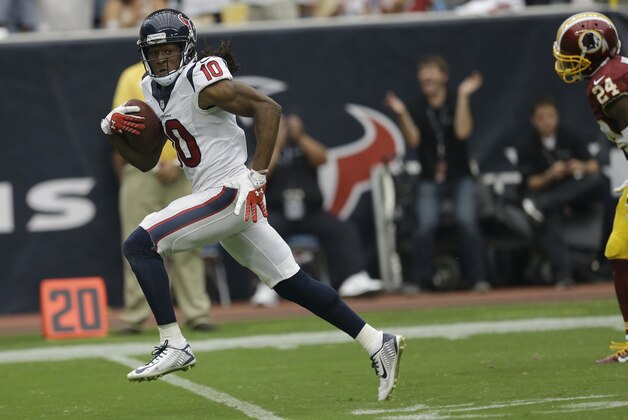Houston Texans' DeAndre Hopkins (10) scores against the Washington Redskins on a 76-yard reception during the second quarter of an NFL football game Sunday, Sept. 7, 2014, in Houston. (AP Photo/David J. Phillip)