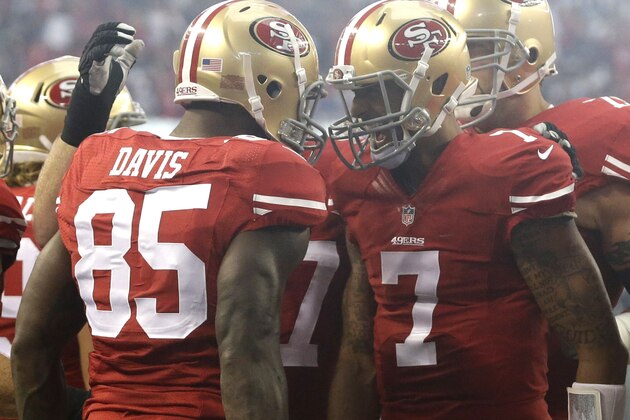 San Francisco 49ers tight end Vernon Davis (85) and San Francisco 49ers quarterback Colin Kaepernick (7) celebrate after scoring a touchdown against the Dallas Cowboys in the first half of an NFL football game, Sunday, Sept. 7, 2014, in Arlington, Texas. (AP Photo/LM Otero)