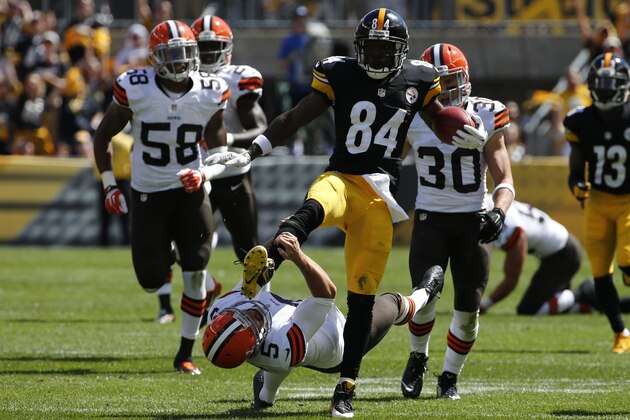 Pittsburgh Steelers Antonio Brown (84) kicks Cleveland Browns punter Spencer Lanning (5) as he jumps while returning a punt in the second quarter of the NFL football game on Sunday, Sept. 7, 2014 in Pittsburgh. Brown was penalized for unnecessary roughness on the play. (AP Photo/Gene J. Puskar)