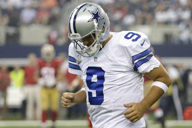 Dallas Cowboys quarterback Tony Romo (9) runs back to the bench after throwing an interception against the San Francisco 49ers in the first half of an NFL football game, Sunday, Sept. 7, 2014, in Arlington, Texas. (AP Photo/Tony Gutierrez)