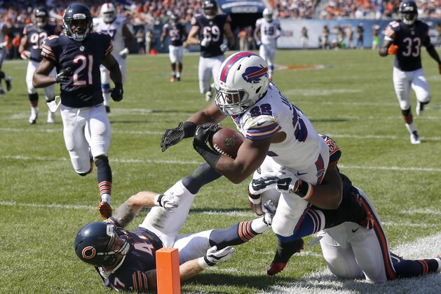 Buffalo Bills running back Fred Jackson (22) tries to stretch for the end zone as he is tackled by Chicago Bears linebacker Jon Bostic (57) during overtime of an NFL football game Sunday, Sept. 7, 2014, in Chicago. The run set up a game-winning field goal in the Bills  23-20 win over the Bears. (AP Photo/Charles Rex Arbogast)
