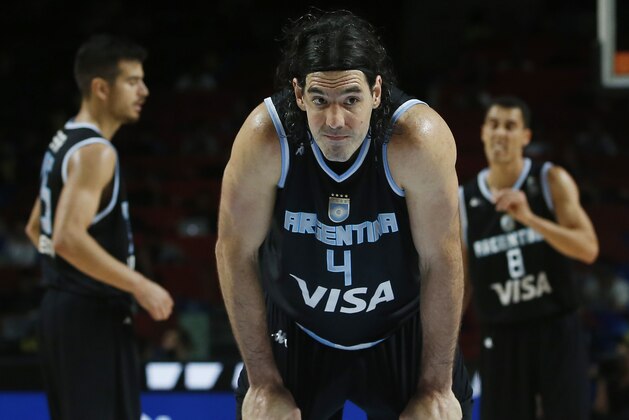 Argentina's Luis Scola, center, gestures during the Basketball World Cup Round of 16 match between Brazil and Argentina in Madrid, Spain, Sunday, Sept. 7, 2014. The 2014 Basketball World Cup competition will take place in various cities in Spain from Aug. 30 through to Sept. 14. (AP Photo/Andres Kudacki)