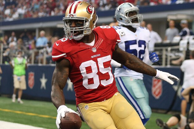 ARLINGTON, TX - SEPTEMBER 07:  Vernon Davis #85 of the San Francisco 49ers reacts after scoring a touchdown as Justin Durant #52 of the Dallas Cowboys is near in the first half at AT&T Stadium on September 7, 2014 in Arlington, Texas.  (Photo by Christian Petersen/Getty Images)