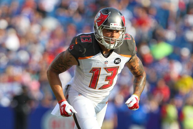 Tampa Bay Buccaneers wide receiver Mike Evans (13) runs a pass route during the first half of a preseason NFL football game against the Buffalo Bills Saturday, Aug. 23, 2014, in Orchard Park, N.Y. (AP Photo/Bill Wippert)