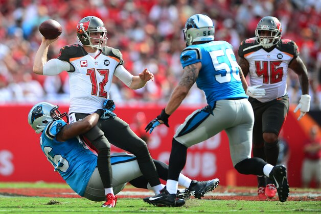 Sep 7, 2014; Tampa, FL, USA; Tampa Bay Buccaneers quarterback Josh McCown (12) is sacked by Carolina Panthers defensive end Wes Horton (96) during the first quarter at Raymond James Stadium. Mandatory Credit: Andrew Weber-USA TODAY Sports
