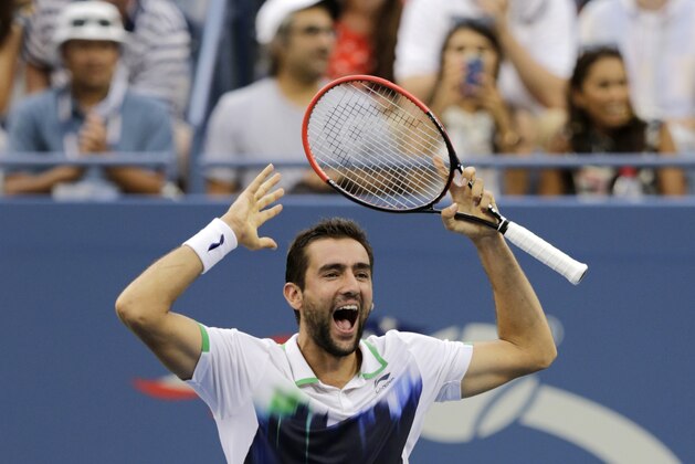Marin Cilic, of Croatia, reacts after defeating Roger Federer, of Switzerland, during the semifinals of the 2014 U.S. Open tennis tournament, Saturday, Sept. 6, 2014, in New York. (AP Photo/Charles Krupa)