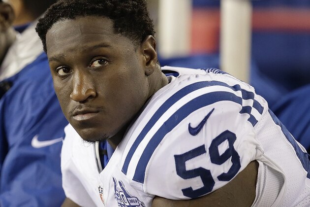 Indianapolis Colts linebacker Cam Johnson (59) watches the action from the bench during the second half of an AFC divisional NFL playoff football game against the New England Patriots in Foxborough, Mass., Saturday, Jan. 11, 2014. The Patriots defeated the Colts 43-22 to advance the AFC Championship game. (AP Photo/Stephan Savoia)