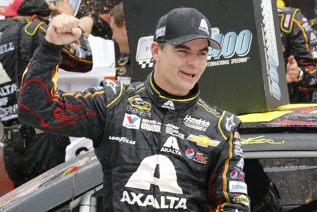 Jeff Gordon celebrates his victory in the NASCAR Sprint Cup Series Pure Michigan 400 auto race at Michigan International Speedway in Brooklyn, Mich., Sunday, Aug. 17, 2014. (AP Photo/Bob Brodbeck)
